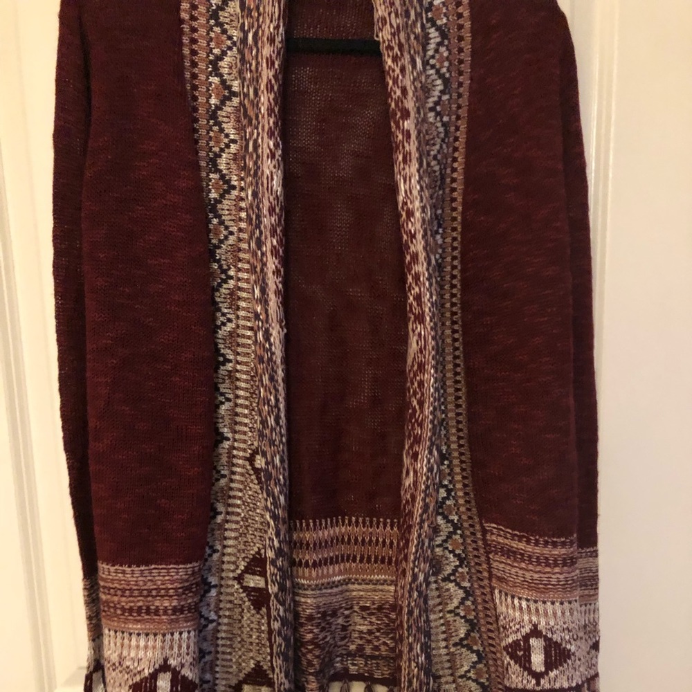 Cute pre owned sweater. Burgundy